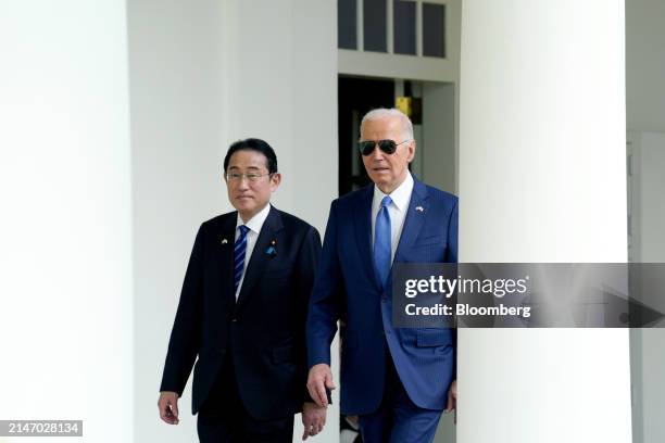 President Joe Biden, right, and Fumio Kishida, Japan's prime minister, walk through the Colonnade of the White House during a state visit in...