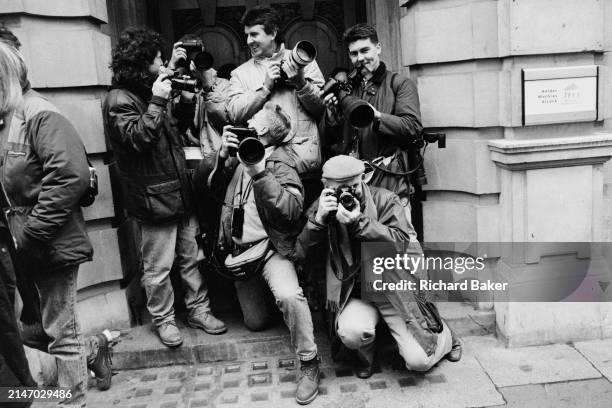 Press photographers wait for a royal appearence outside the Portland hospital where the Prince Andrew and Sarah Ferguson's baby, Princess Eugenie was...