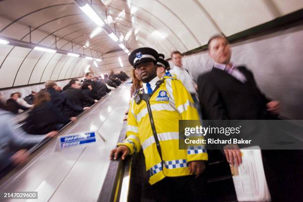 British Transport PCSOs patrol the London Underground public transport system, on 25th June 2005, in London, England. Police Community Support...