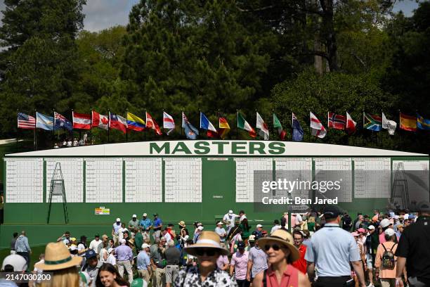 Large leaderboard on course as patrons file through during practice prior to Masters Tournament at Augusta National Golf Club on April 10, 2024 in...