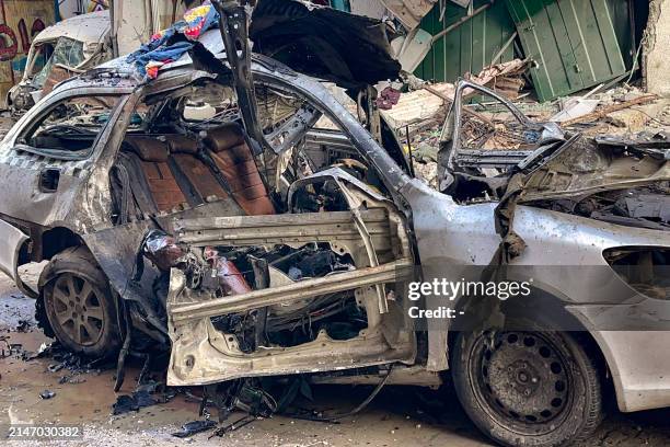 The car in which three sons of Hamas leader Ismail Haniyeh were reportedly killed in an Israeli air strike is pictured in al-Shati camp, west of Gaza...