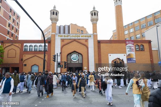 Muslims wearing colorful traditional clothes gather at East London Mosque to perform the prayer of Eid al-Fitr that marks end of the fasting month of...