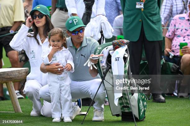 Rickie Fowler with his wife, Allison Stokke and daughter, Maya, during the Par-3 Contest prior to Masters Tournament at Augusta National Golf Club on...