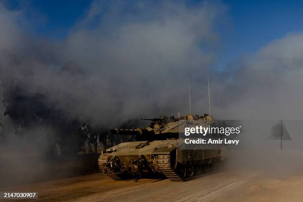 An Israeli moves near the border with the Gaza Strip before entering into the Gaza Strip on April 10, 2024 in Southern Israel. April 7th marks six...