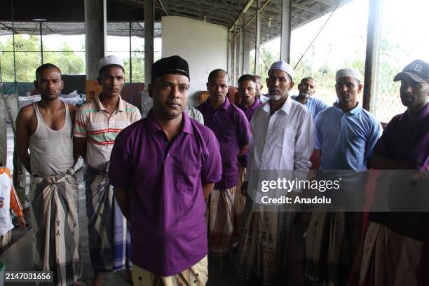 Rohingya ethnic refugees pray on the first day of the Eid al-Fitr at the Idi Sport Center temporary shelter in East Aceh, Indonesia on April 10,...