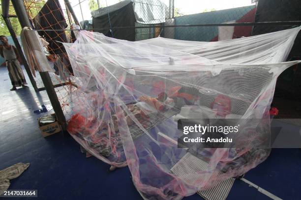 Rohingya ethnic refugees pray on the first day of the Eid al-Fitr at the Idi Sport Center temporary shelter in East Aceh, Indonesia on April 10,...