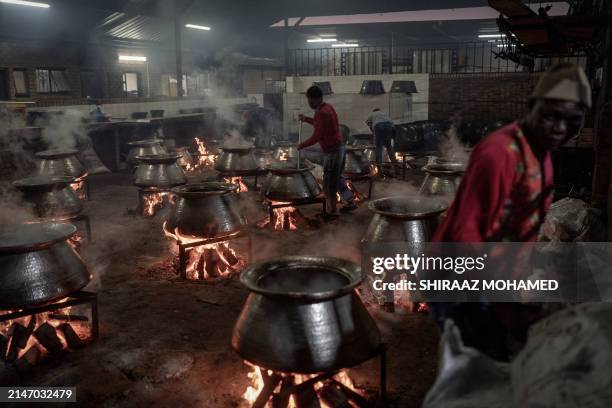 Muslim volunteers at the Saaberie Chishty Mosque prepares meals to be distributed in a charity food distribution for the Muslim festival of Eid...