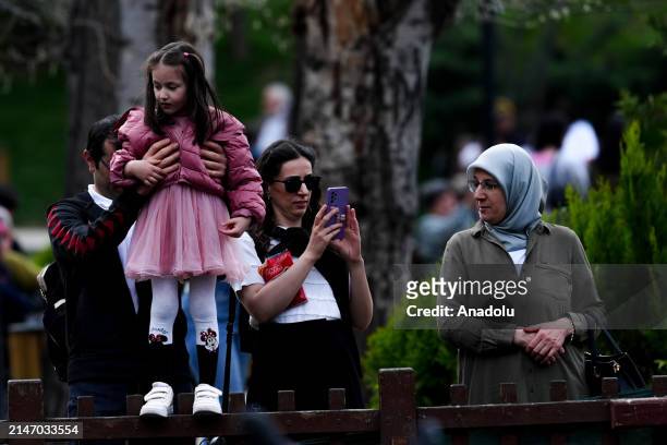 People enjoy the sunny day during the Eid al-Fitr holiday in Ankara, Turkiye on April 10, 2024. Those who spent the holiday in Ankara spent the first...