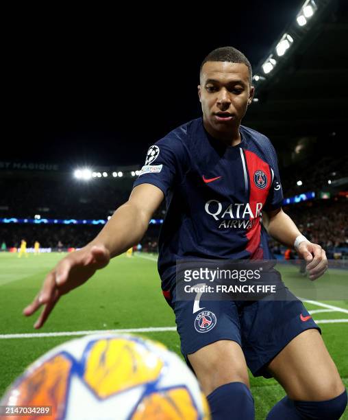 Paris Saint-Germain's French forward Kylian Mbappe controls the ball off the field of play during the UEFA Champions League quarter final first leg...
