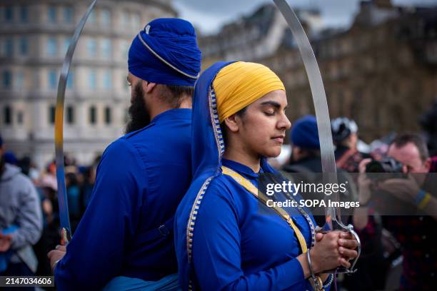 Martial artists pose with swords during the Vaisakhi Festival at London's Trafalgar Square. The Vaisakhi Festival was co-hosted by Tommy Sandhu and...