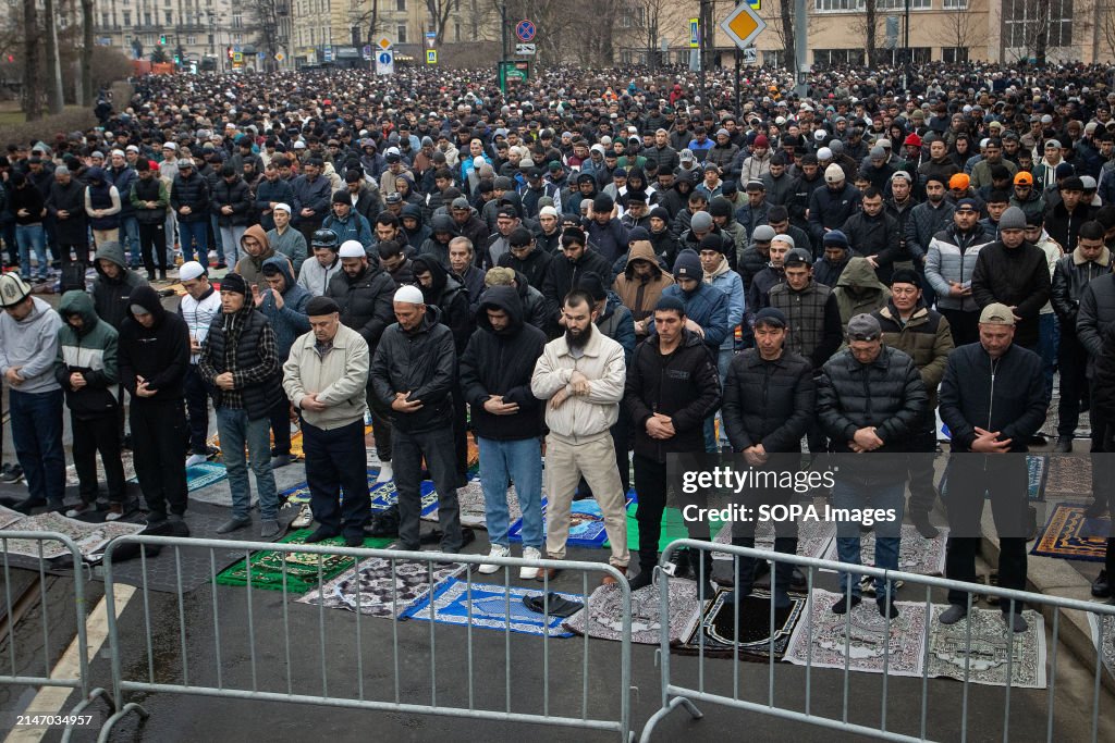 Muslims offer prayers near the St. Petersburg Cathedral...