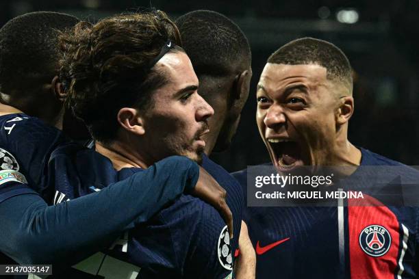 Paris Saint-Germain's French forward Kylian Mbappe celebrates after Paris Saint-Germain's French forward Ousmane Dembele scored an equalizer during...