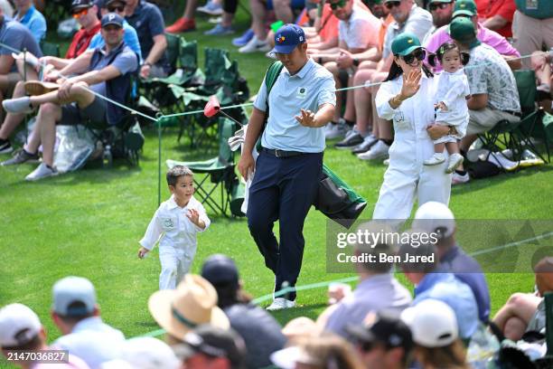 Byeong Hun An of South Korea and his wife, Jamie and their children during the Par-3 Contest, prior to Masters Tournament at Augusta National Golf...