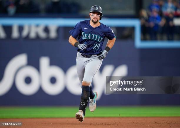 Cal Raleigh of the Seattle Mariners runs the bases on his two run home run against the Toronto Blue Jays during the tenth inning in their MLB game at...