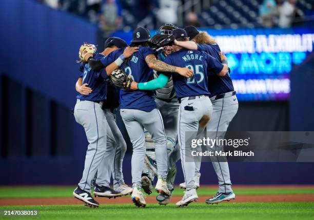 Seattle Mariners players celebrate defeating the Toronto Blue Jays in their MLB game at the Rogers Centre on April 10, 2024 in Toronto, Ontario,...