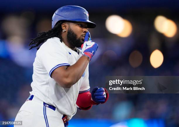 Vladimir Guerrero Jr. #27 of the Toronto Blue Jays celebrates his home run against the Seattle Mariners during the seventh inning in their MLB game...