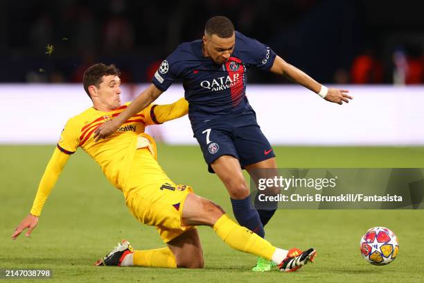 Kylian Mbappe of Paris Saint-Germain is challenged by Andreas Christensen of FC Barcelona during the UEFA Champions League quarter-final first leg...