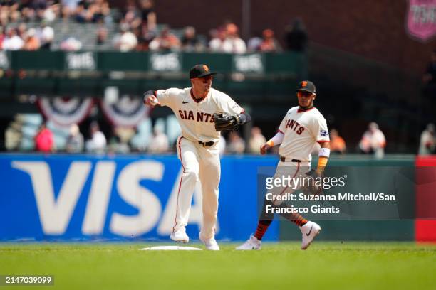 Nick Ahmed of the San Francisco Giants fields a double play at Oracle Park on April 10, 2024 in San Francisco, California.