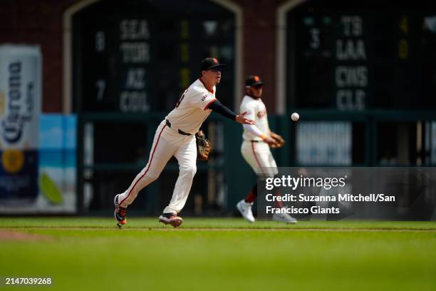 Wilmer Flores of the San Francisco Giants underhands a ball at Oracle Park on April 10, 2024 in San Francisco, California.