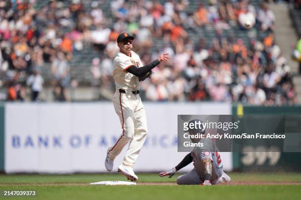 Nick Ahmed of the San Francisco Giants fields a double play after stepping on second base at Oracle Park on April 10, 2023 in San Francisco,...