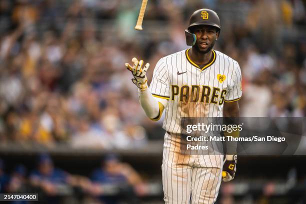 Jurickson Profar of the San Diego Padres tosses his bat after hitting a home run in the sixth inning against the Chicago Cubs on April 10, 2024 at...