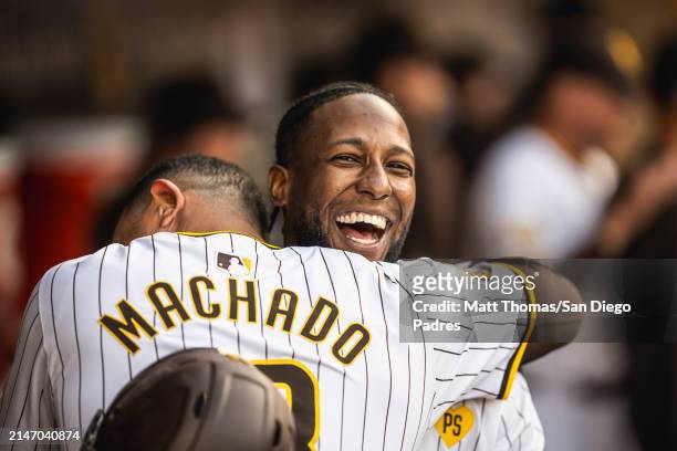 Jurickson Profar and Manny Machado of the San Diego Padres hug after hitting a home run in the sixth inning against the Chicago Cubs on April 10,...