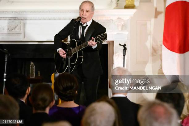 Singer-songwriter Paul Simon performs during a reception hosted by US President Joe Biden and First Lady Jill Biden for Japanese Prime Minister Fumio...