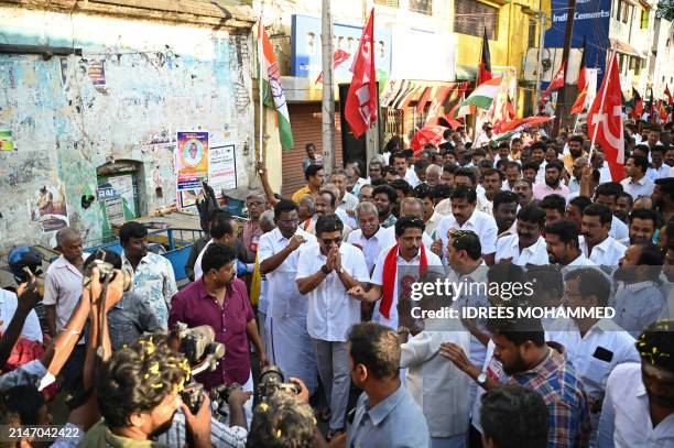 This photograph taken on March 27, 2024 shows Su. Venkatesan , Communist Party of India CPI candidate for Madurai constituency, with Palanivel Thiaga...