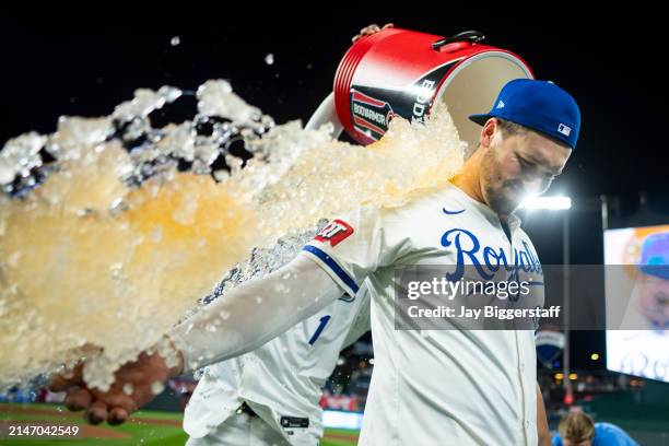 Vinnie Pasquantino of the Kansas City Royals is doused with water by MJ Melendez after defeating the Houston Astros at Kauffman Stadium on April 10,...