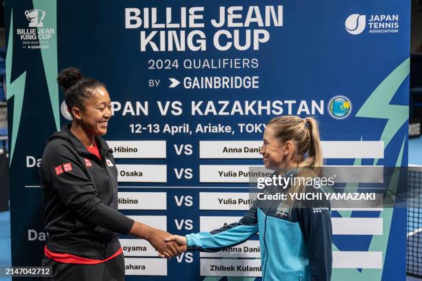 Naomi Osaka of Japan and Yulia Putintseva of Kazakhstan shake hands during the draw ceremony prior to the Billie Jean King Cup qualifier tie between...