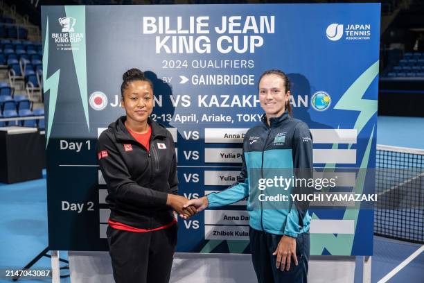 Naomi Osaka of Japan and Anna Danilina of Kazakhstan shake hands during the draw ceremony prior to the Billie Jean King Cup qualifier tie between...