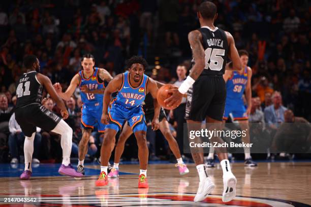 Adam Flagler of the Oklahoma City Thunder plays defense against the San Antonio Spurs on April 10, 2024 at Paycom Arena in Oklahoma City, Oklahoma....