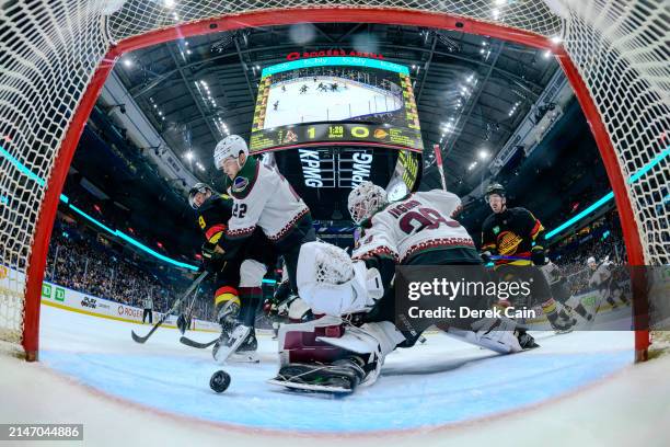 Miller of the Vancouver Canucks scores a goal against Connor Ingram of the Arizona Coyotes during the second period of their NHL game at Rogers Arena...