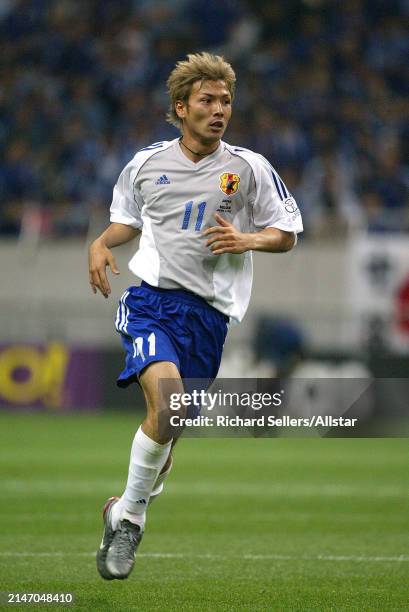 June 4: Takayuki Suzuki of Japan running during the FIFA World Cup Finals 2002 Group H match between Japan and Belgium at Saitama Stadium on June 4,...