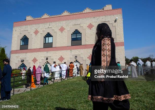 Muslims of different nationalities living in United States gather to perform Eid al-Fitr prayer, marking the end of the fasting month of Ramadan at...