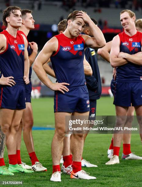 Jack Viney of the Demons looks dejected after a loss during the 2024 AFL Round 05 match between the Melbourne Demons and the Brisbane Lions at the...