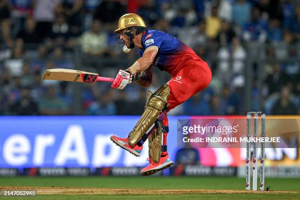 Royal Challengers Bengaluru's captain Faf du Plessis reacts after being hit by the ball during the Indian Premier League Twenty20 cricket match...