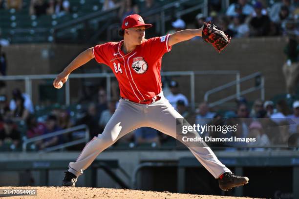 Julian Aguiar of the Cincinnati Reds throws a pitch during the eighth inning of a spring training game against the Colorado Rockies at Salt River...