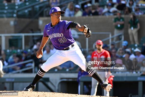 Juan Mejia of the Colorado Rockies throws a pitch during the eighth inning of a spring training game against the Cincinnati Reds at Salt River Fields...