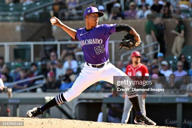 Juan Mejia of the Colorado Rockies throws a pitch during the eighth inning of a spring training game against the Cincinnati Reds at Salt River Fields...