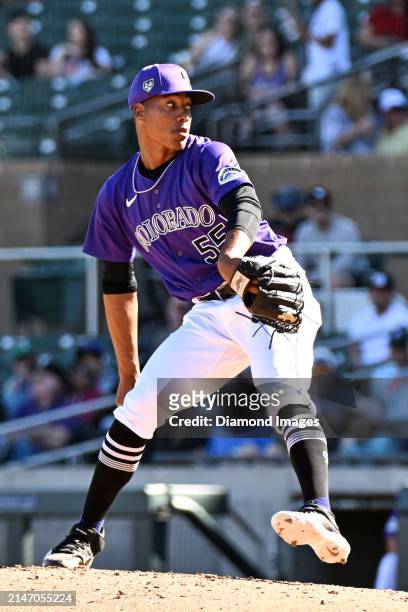Juan Mejia of the Colorado Rockies throws a pitch during the eighth inning of a spring training game against the Cincinnati Reds at Salt River Fields...