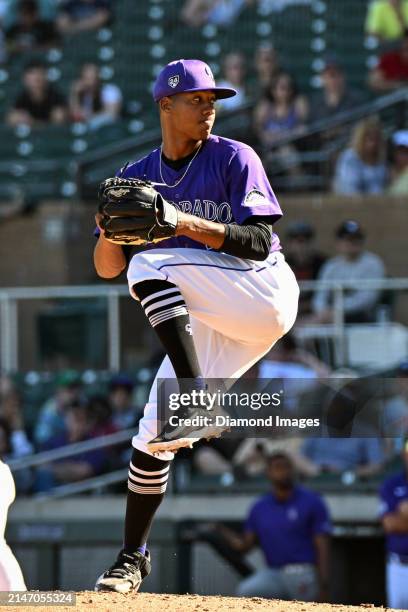 Juan Mejia of the Colorado Rockies throws a pitch during the eighth inning of a spring training game against the Cincinnati Reds at Salt River Fields...