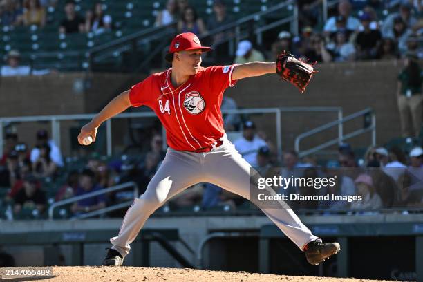 Julian Aguiar of the Cincinnati Reds throws a pitch during the eighth inning of a spring training game against the Colorado Rockies at Salt River...