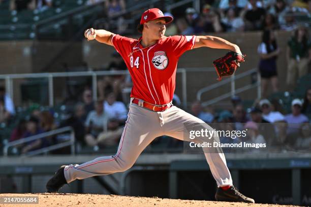 Julian Aguiar of the Cincinnati Reds throws a pitch during the eighth inning of a spring training game against the Colorado Rockies at Salt River...