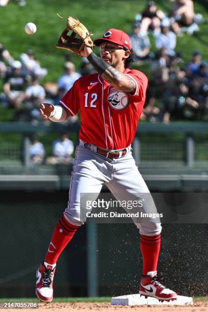 Miguel Hernandez of the Cincinnati Reds covers as Aaron Schunk of the Colorado Rockies runs out a double during the eighth inning of a spring...