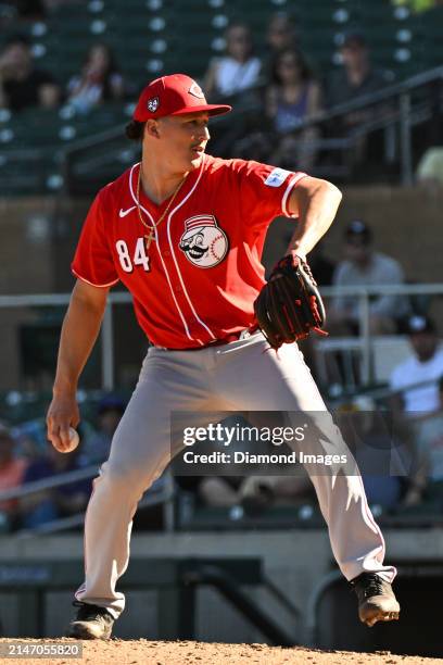 Julian Aguiar of the Cincinnati Reds throws a pitch during the eighth inning of a spring training game against the Colorado Rockies at Salt River...