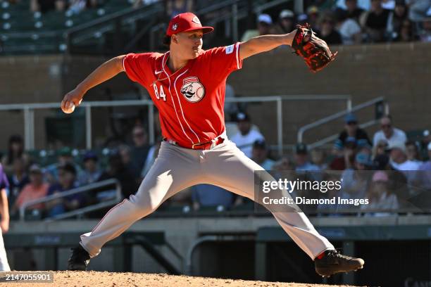 Julian Aguiar of the Cincinnati Reds throws a pitch during the eighth inning of a spring training game against the Colorado Rockies at Salt River...