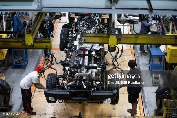 The new Ford F-150 truck goes through the assembly line at the Ford Dearborn Plant on April 11, 2024 in Dearborn, Michigan. Both the new F-150 and...
