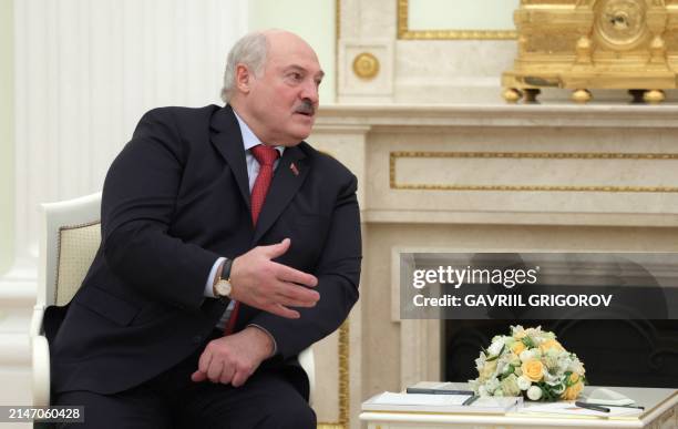 In this pool photograph distributed by the Russian state agency Sputnik, Belarusian President Alexander Lukashenko attends a meeting with Russian...