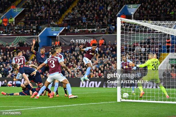 Aston Villa's English striker Ollie Watkins scores the opening goal during the UEFA Europa Conference League quarter-final first leg football match...